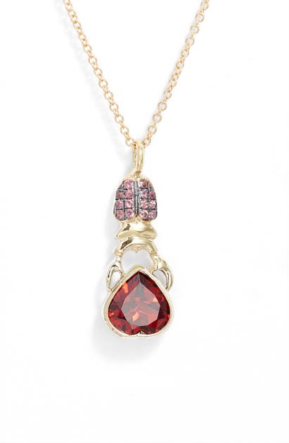Click to view more detailed imagery on our partner's website Daniela Villegas Khepri Sapphire & Garnet Pendant Necklace In Yellow Gold