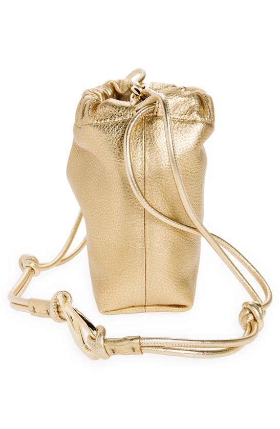 Shop Valentino Mini Vlogo Metallic Leather Drawstring Bag In 39l Mekong