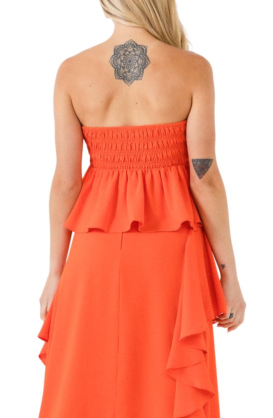 Endless Rose Smocked Strapless Peplum Top In Orange