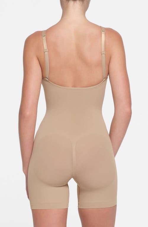 Shop Skims Seamless Sculpt Plunge Mid Thigh Bodysuit In Clay