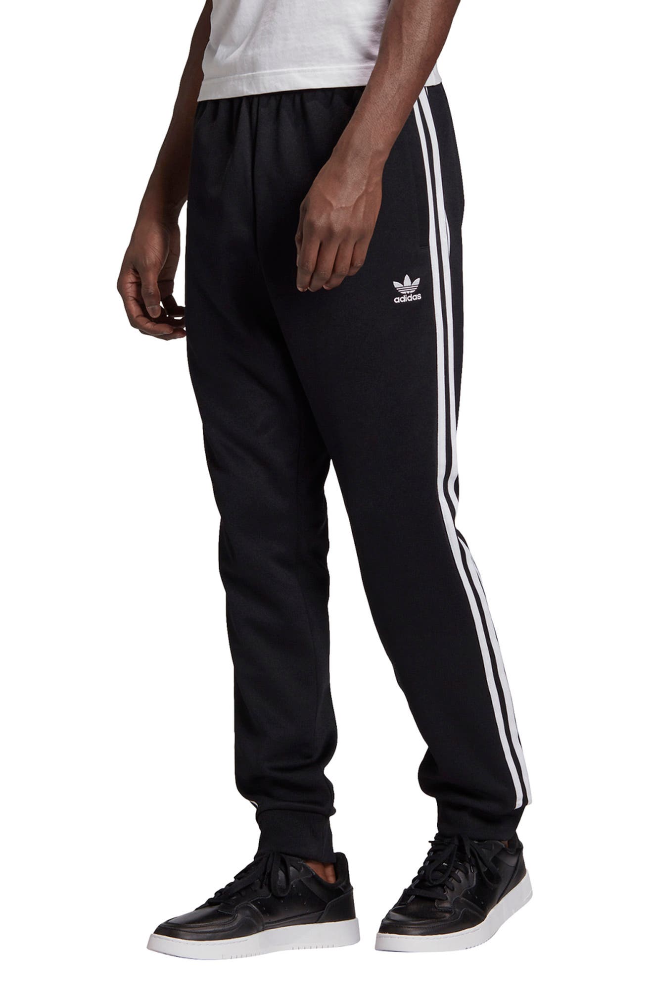 white adidas track pants