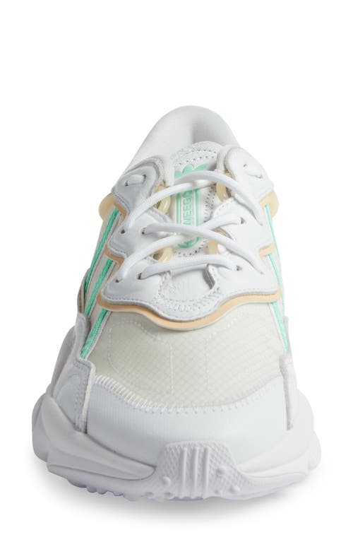 Shop Adidas Originals Adidas Ozweego Sneaker In White/mint/sand Strata