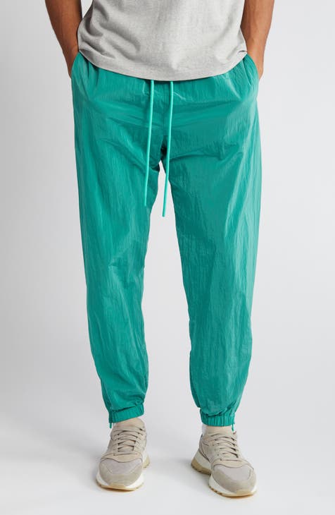 Green Relaxed Lounge Pants by Fear of God ESSENTIALS on Sale