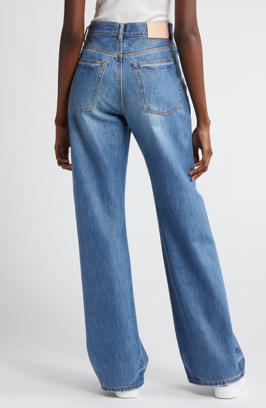 Shop Purple Brand Coated Wide Leg Jeans In Mid Indigo