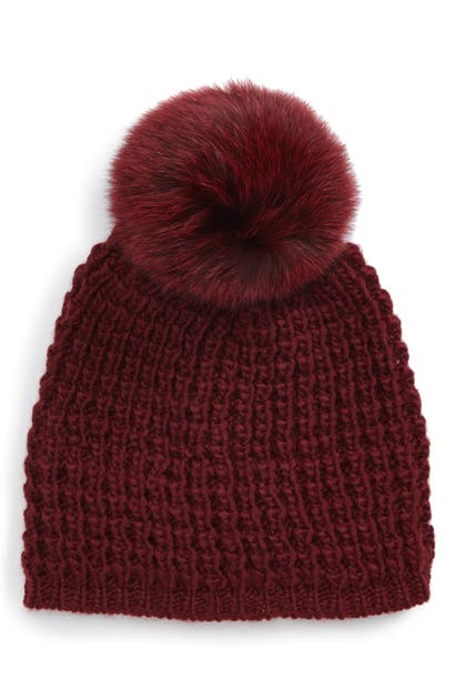Click to view more detailed imagery on our partner's website Kyi Kyi Genuine Fox Pompom Hat In Bordeaux/ Bordeaux Pom