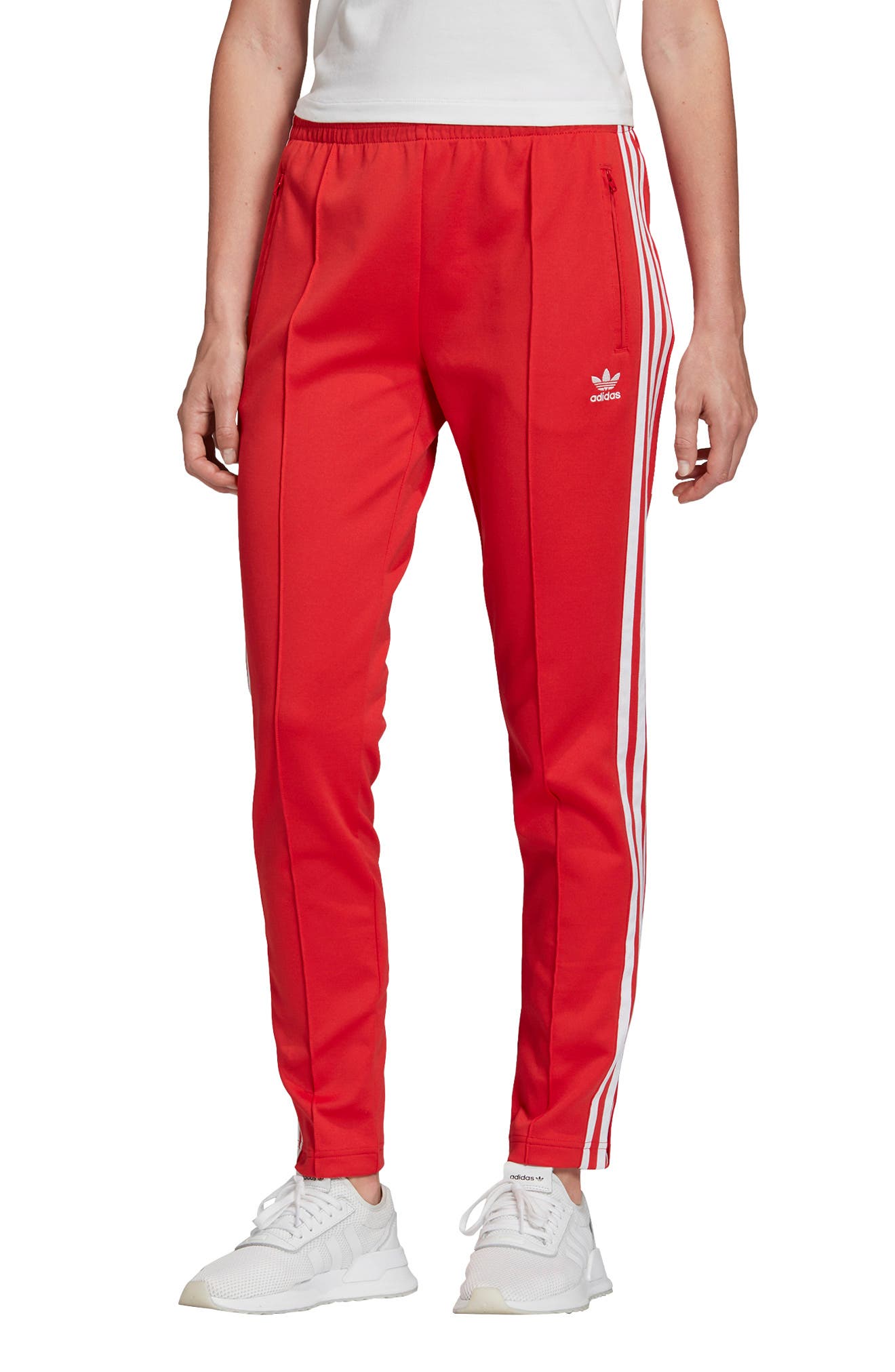 white and red adidas track pants