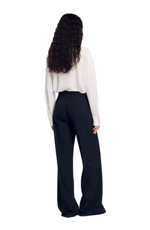 Shop Sandro Chalk-striped Trousers In Black