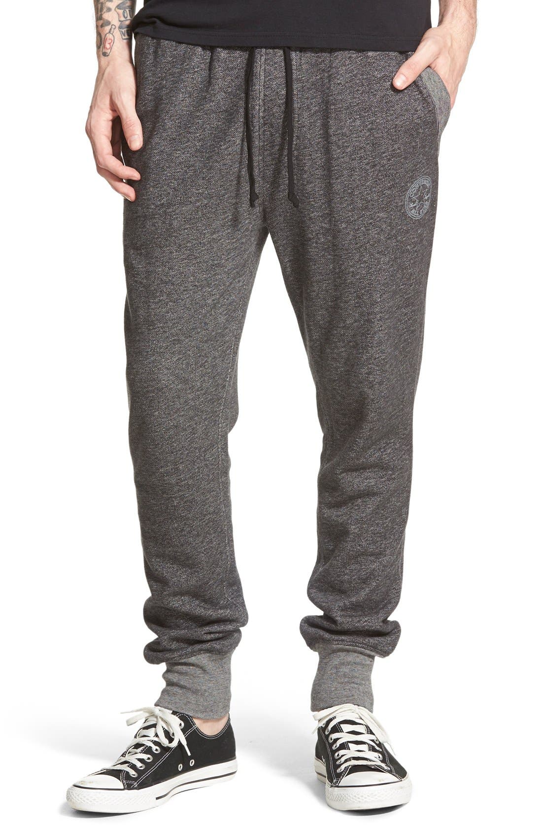 sweatpants and converse shoes