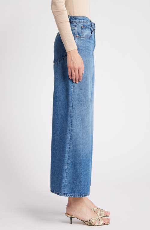 Shop Frame Pixie Easy Wide Leg Flare Jeans In Lucite