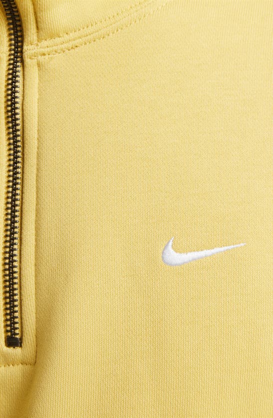 Nike Solo Swoosh Oversize Quarter Zip Sweatshirt In Saturn Gold/ White