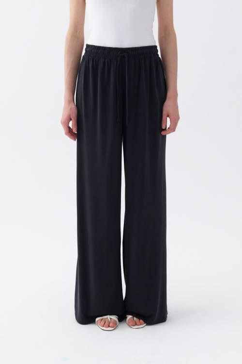 Shop Nocturne Loose Fit Wide Leg Pants In Black