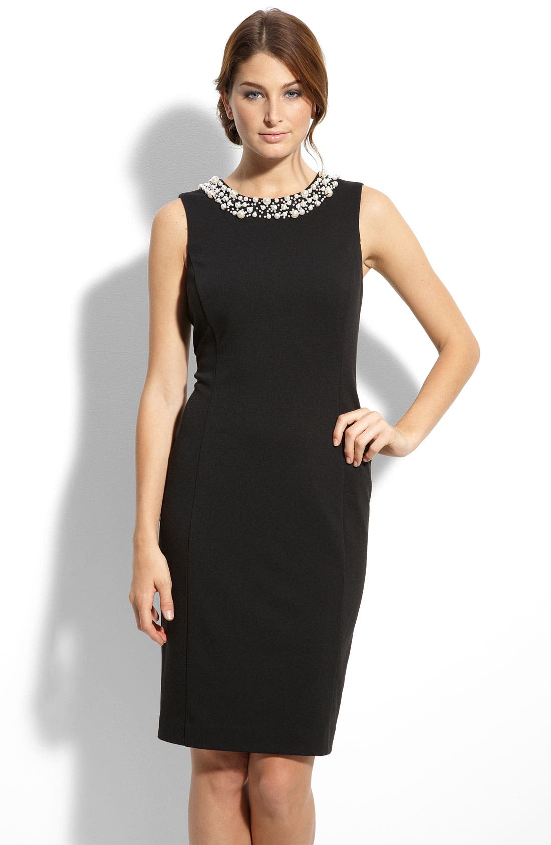 black dress with pearls on neckline