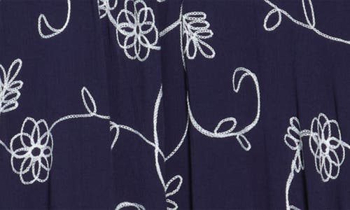 Shop Forgotten Grace Floral Embroidered Sharkbite Tunic Blouse In Navy/white