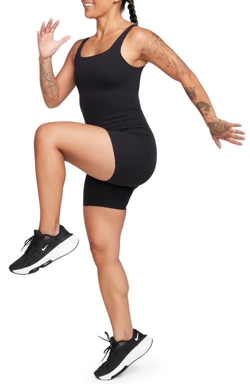 Shop Nike Infinasoft Essentials Dri-fit Romper In Black/pcg6c