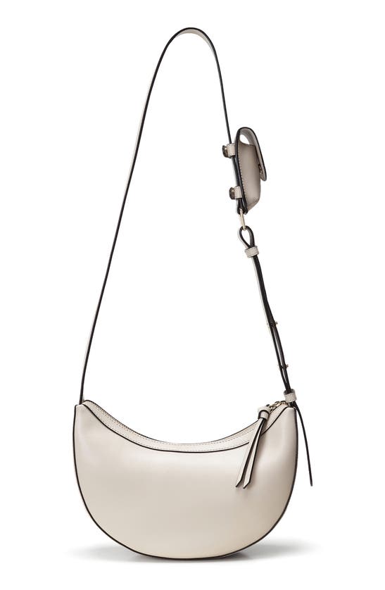 Shop Oryany Rookie Crescent Crossbody Bag In Cream