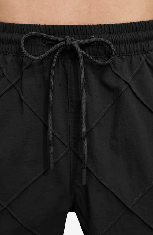 Shop Dkny Diamond Pintuck Swim Trunks In Black