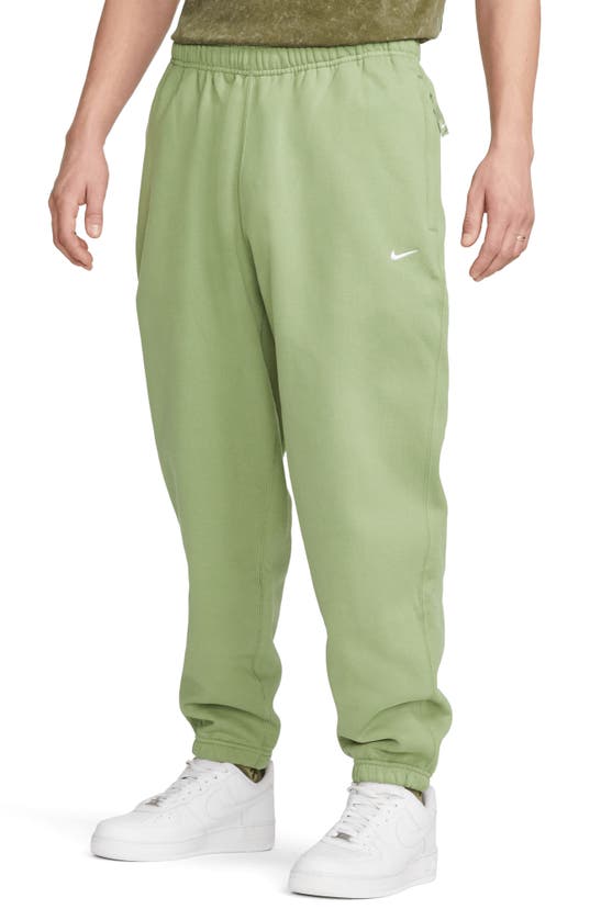 Nike Solo Swoosh Woven Track Pants Green In Multicolor