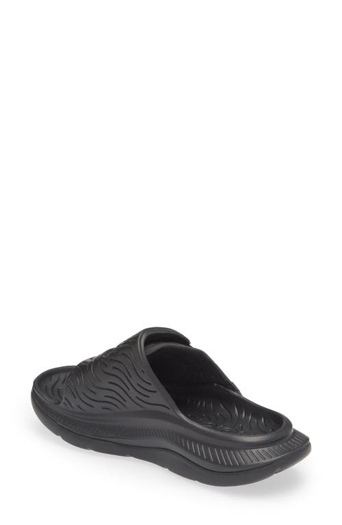 Shop Hoka Gender Inclusive Ora Luxe Slide Sandal In Black/black