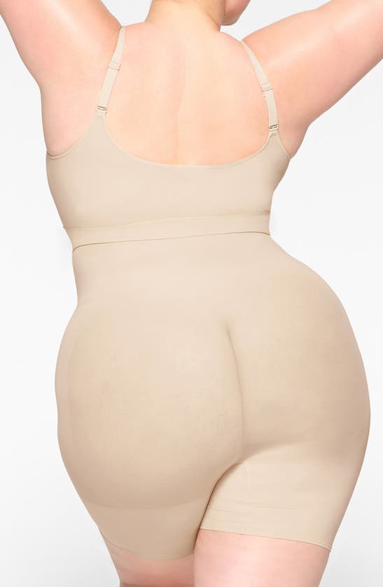 Skims Seamless Sculpt Low Back Mid Thigh Bodysuit In Sand