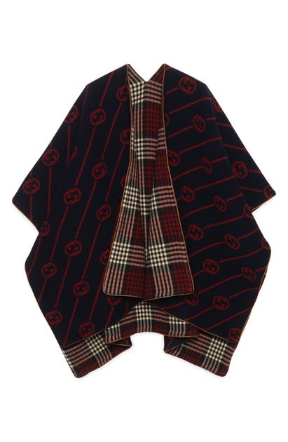 Click to view more detailed imagery on our partner's website Gucci Reversible Interlocking-g Wool Poncho In Midnight Blue / Red