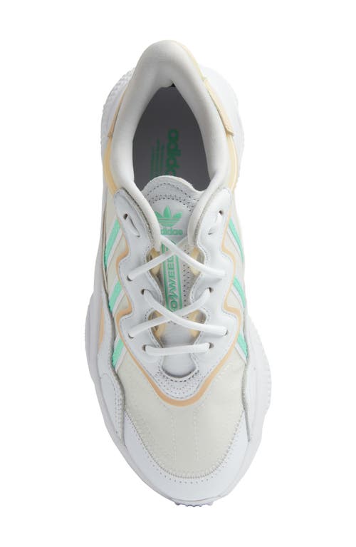 Shop Adidas Originals Adidas Ozweego Sneaker In White/mint/sand Strata