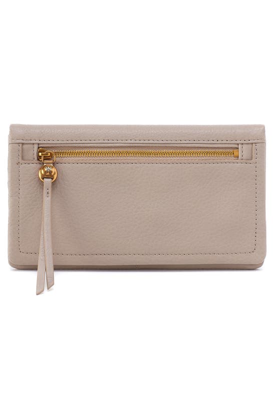 Shop Hobo Lumen Leather Bifold Wallet In Taupe