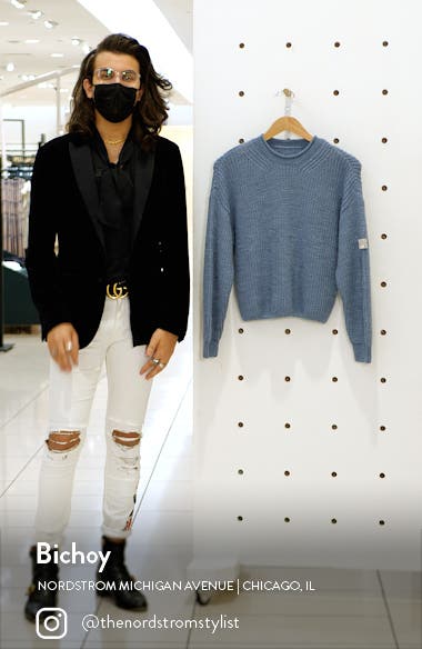 green sweater khaki pants