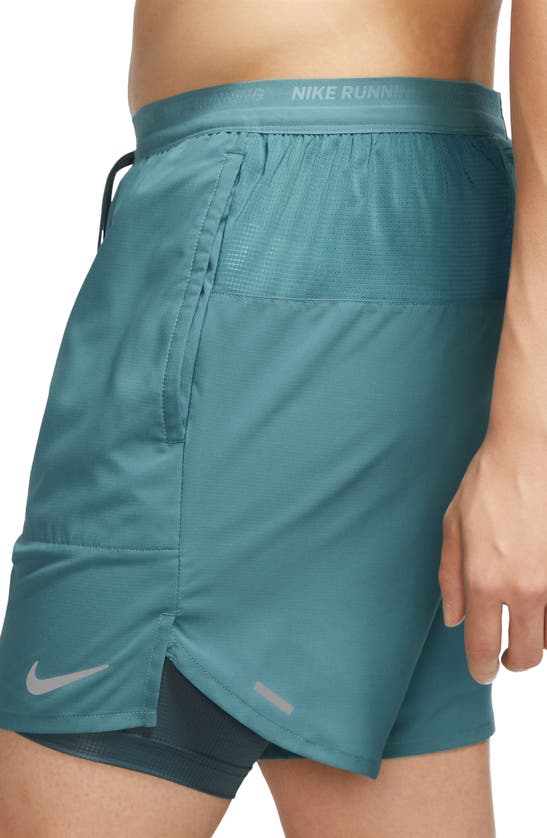 Shop Nike Dri-fit Stride 2-in-1 Running Shorts In Mineral Teal/ Reflective Silv