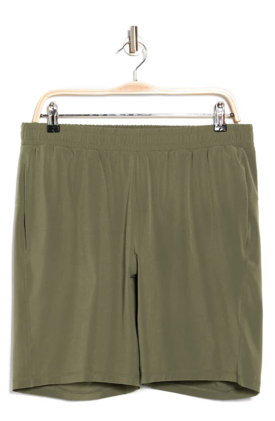 Shop Z By Zella 9" Traverse Woven Shorts In Olive Night