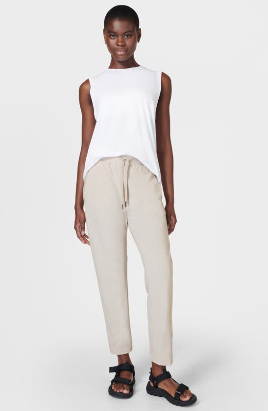 Shop Sweaty Betty Explorer Tapered Athletic Pants In Mineral Beige