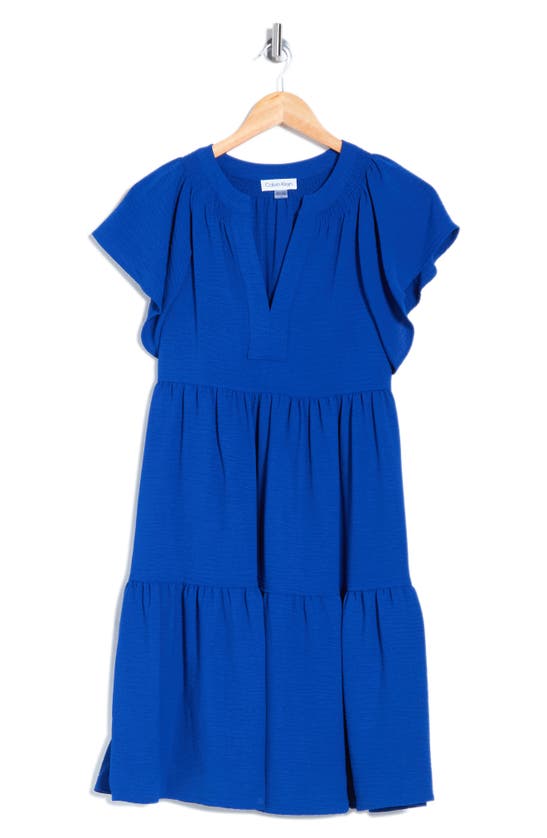 Shop Calvin Klein Aerowash Split Neck Tiered Dress In Ultramarin