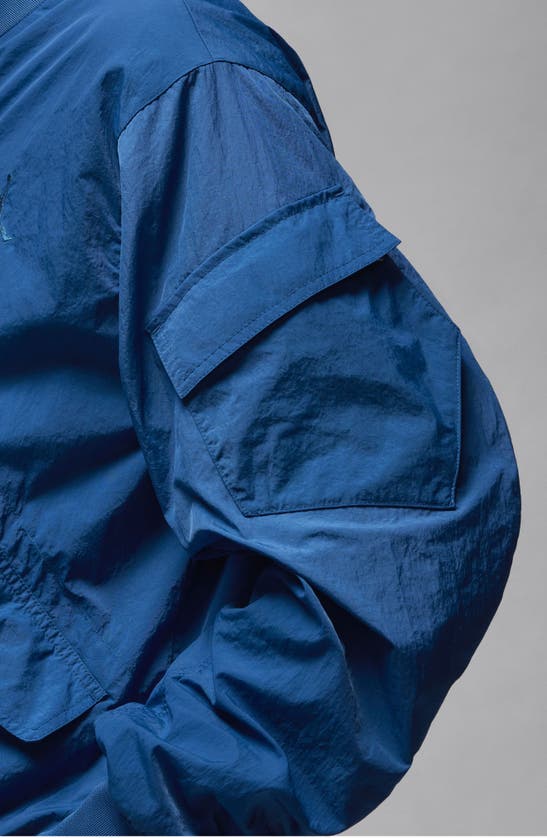 Shop Jordan Essentials Lightweight Nylon Renegade Jacket In Industrial Blue