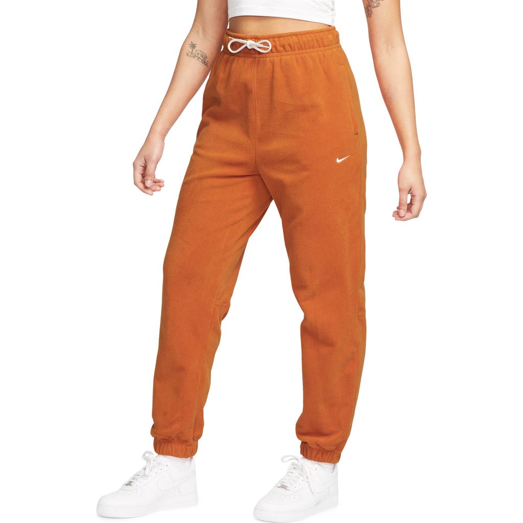 Shop Nike Therma-fit Pants In Campfire Orange/pale Ivory