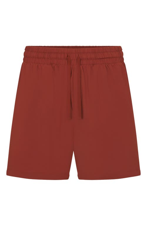 Shop Skims Outdoor Jersey Sweat Shorts In Rust