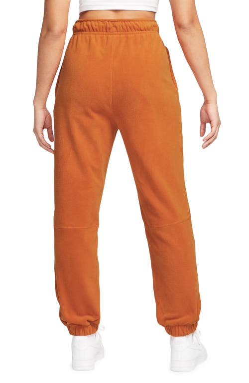 Shop Nike Therma-fit Pants In Campfire Orange/pale Ivory