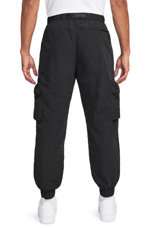 Shop Nike Tech Water Repellent Woven Cargo Pants In Black/black