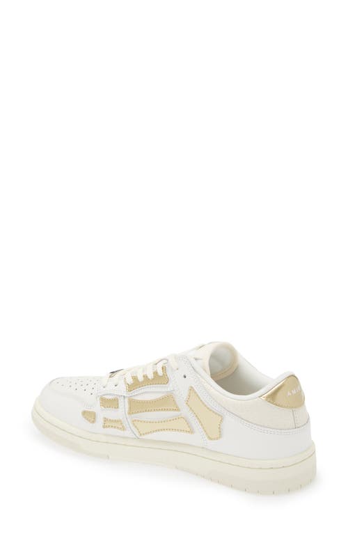 Shop Amiri Metallic Skel Low Top Sneaker In White/gold