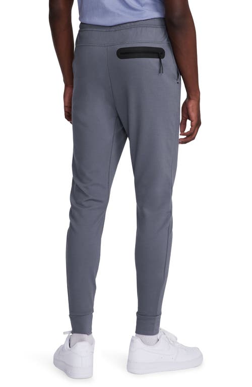 Shop Nike Lightweight Tech Knit Joggers In Light Carbon/black