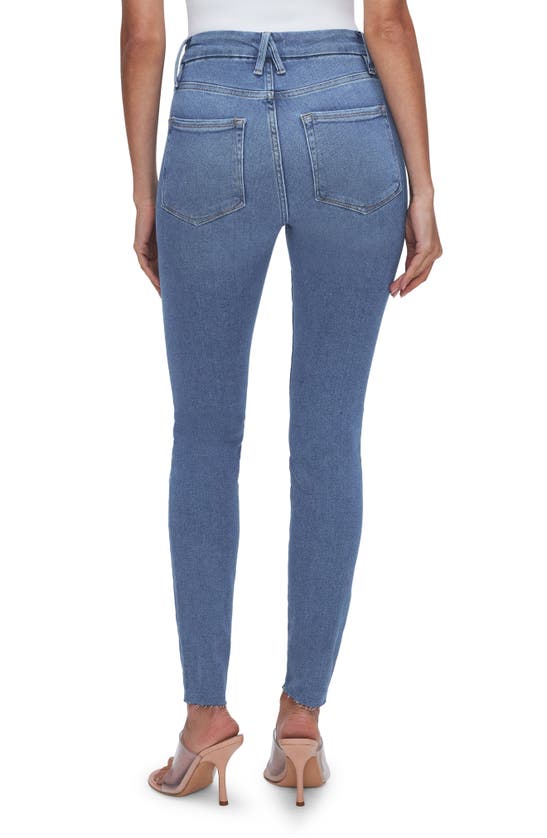 Shop Good American Good Legs Raw Hem Mid Rise Skinny Jeans In Blue655