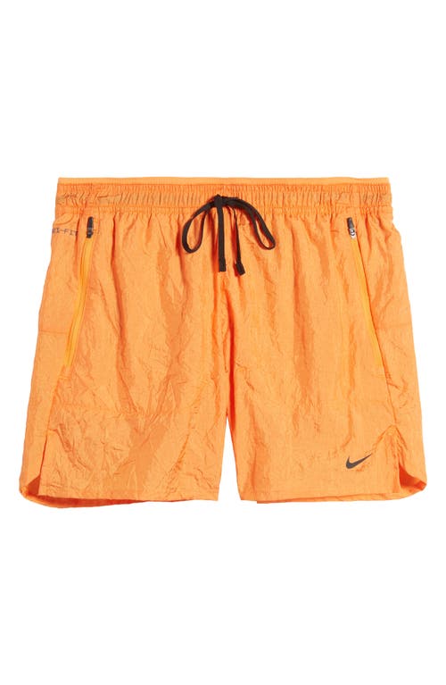 Shop Nike Dri-fit Stride Running Division Shorts In Bright Mandarin/black