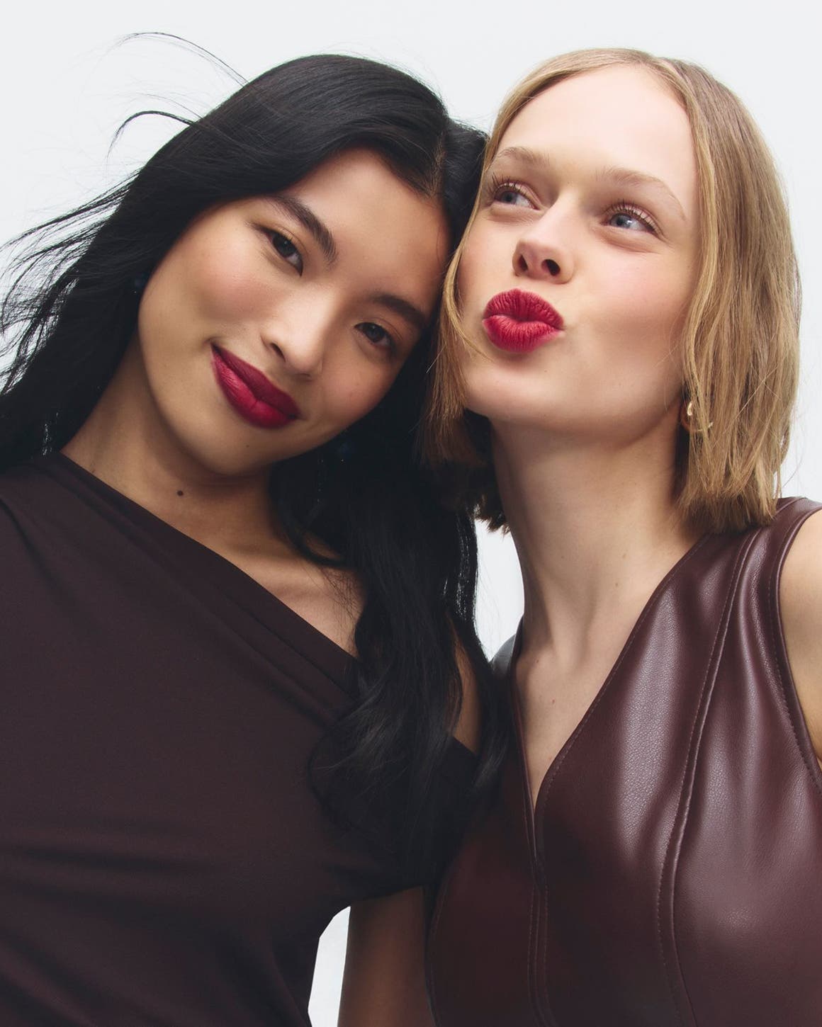 Early Access beauty exclusives: two women with red lips.