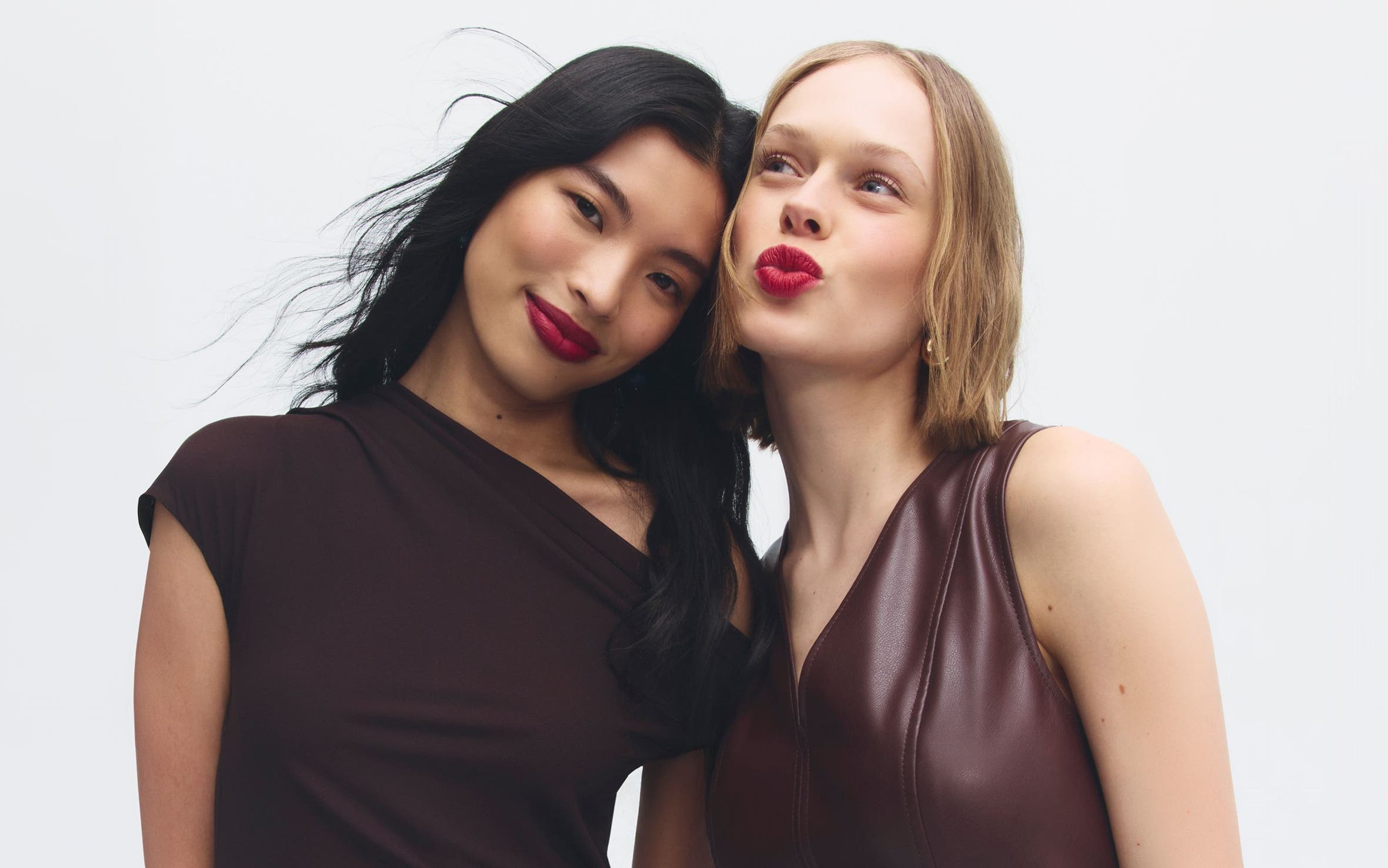 Early Access beauty exclusives: two women with red lips.