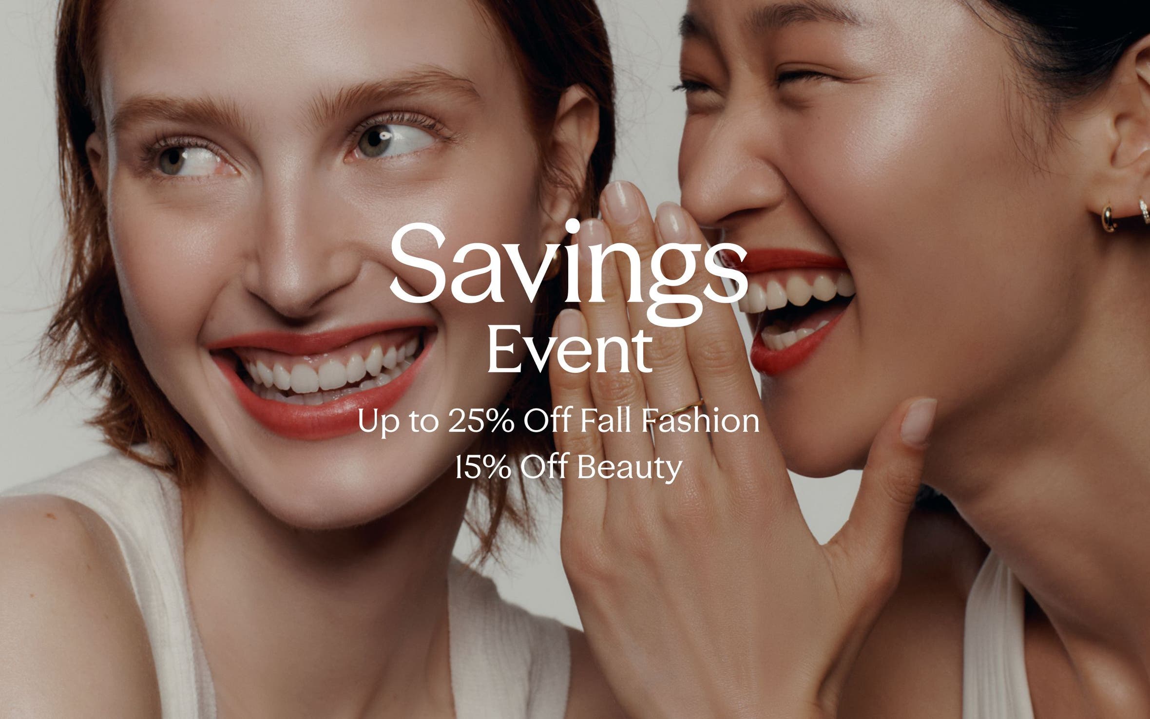Savings event: up to 25% off fall fashion and 15% off beauty. A woman telling another woman a secret.