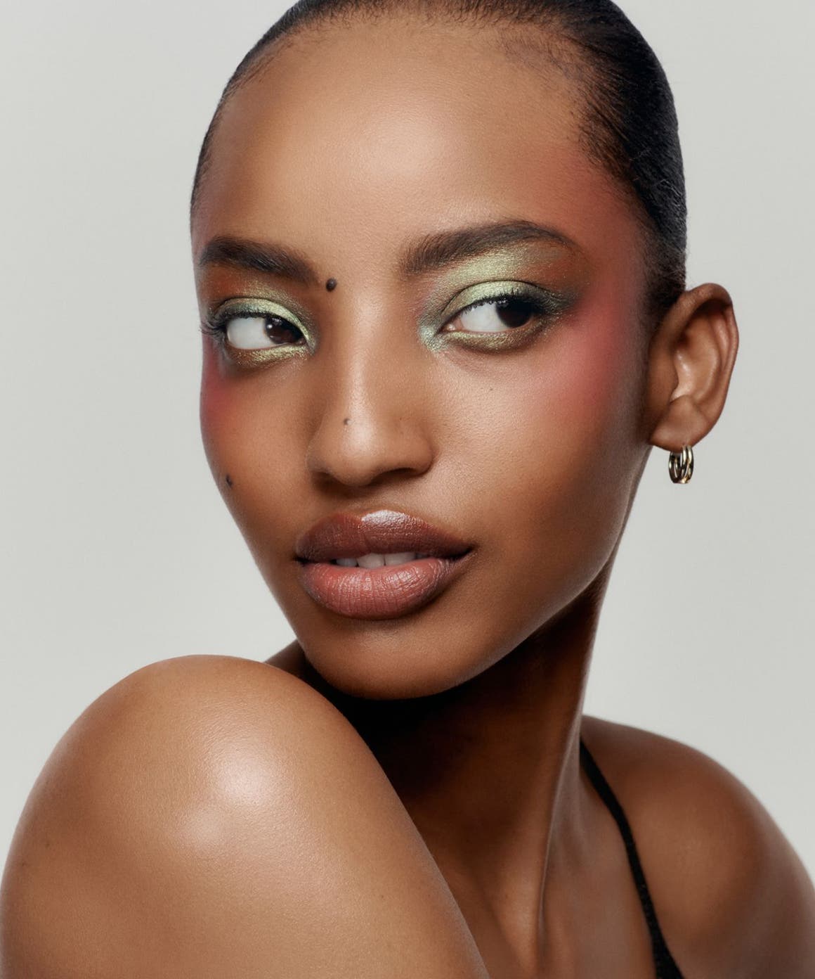 Model wearing soft-focus makeup.