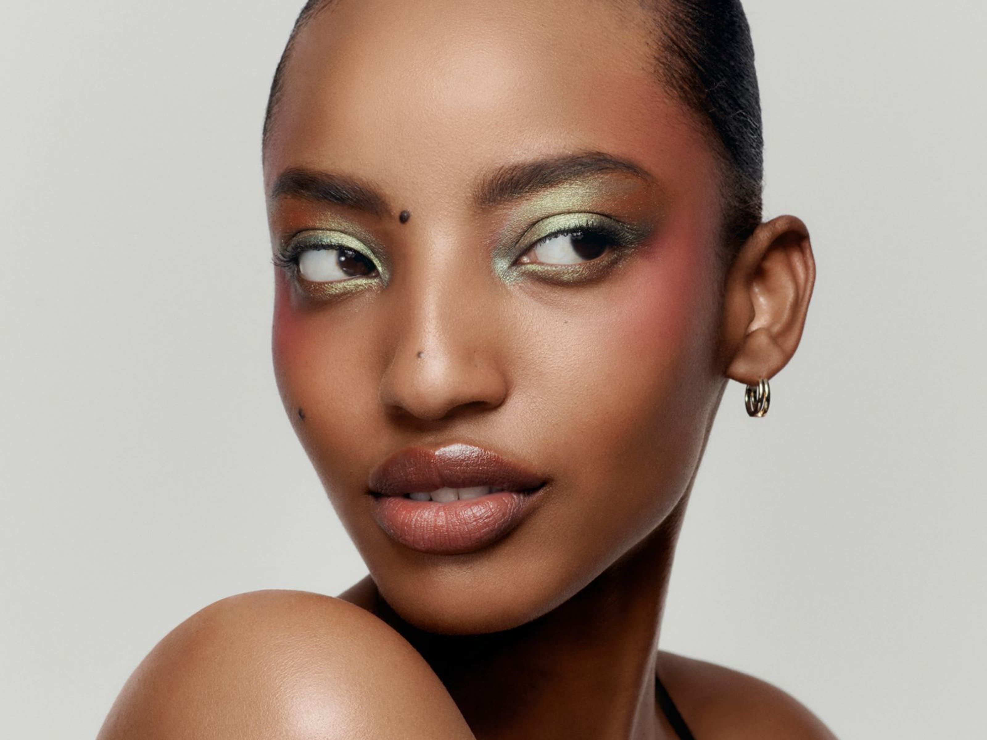 Model wearing soft-focus makeup.