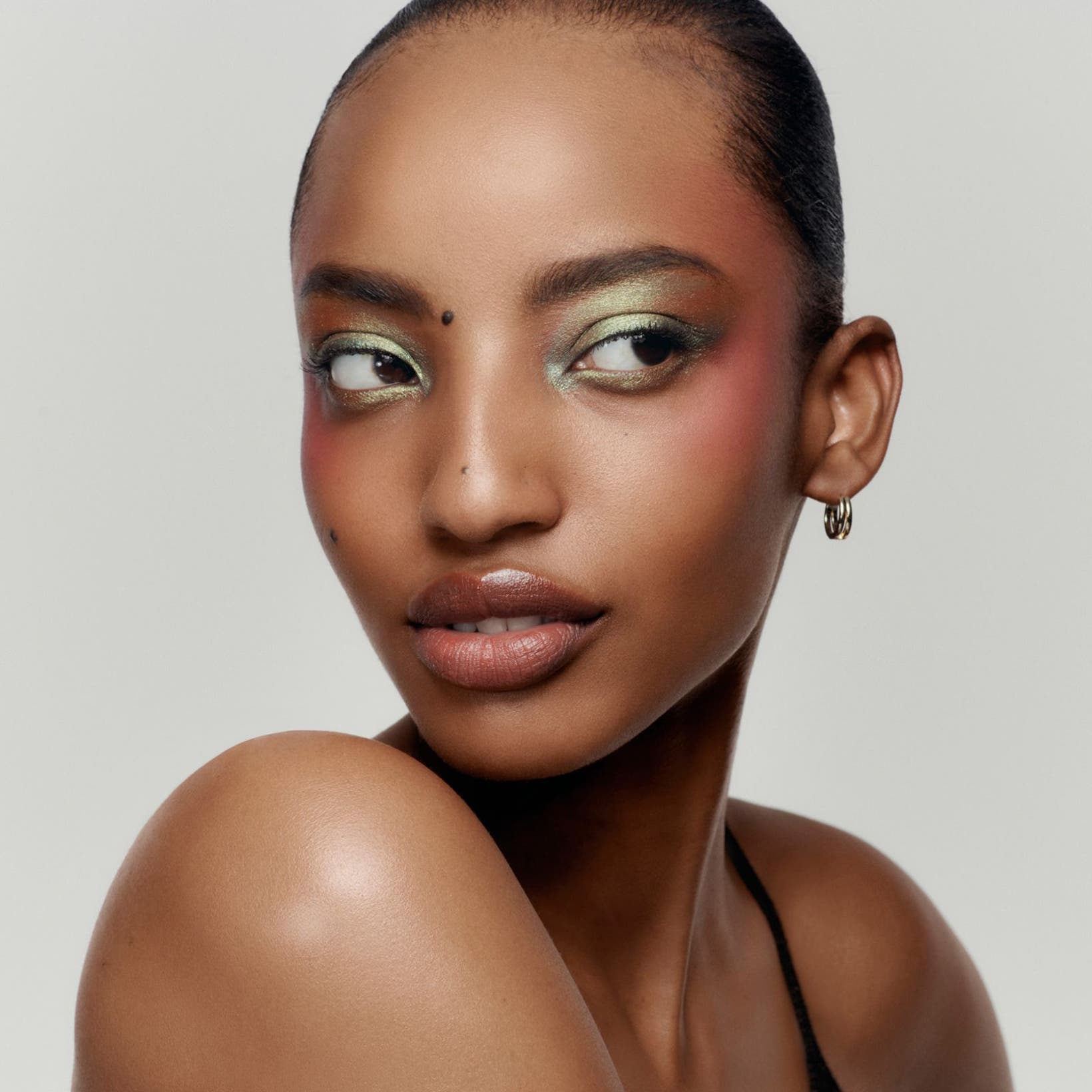 Model wearing soft-focus makeup.