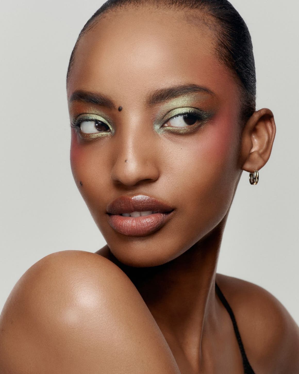 Model wearing soft-focus makeup.
