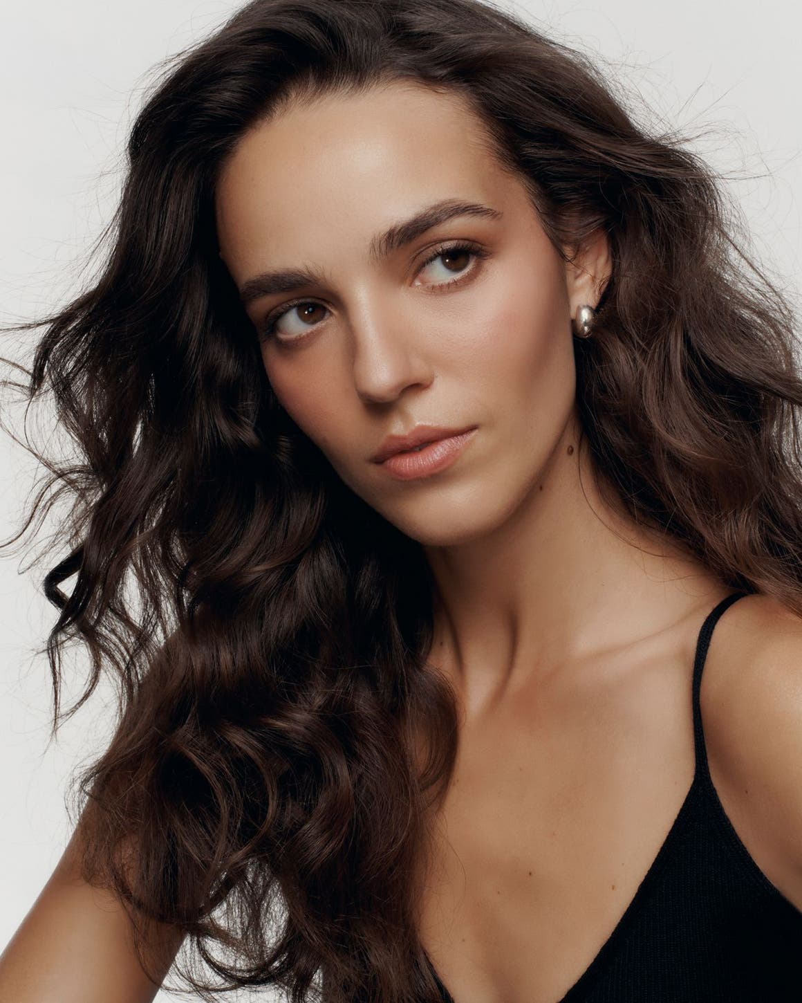 Woman with long, wavy dark hair.