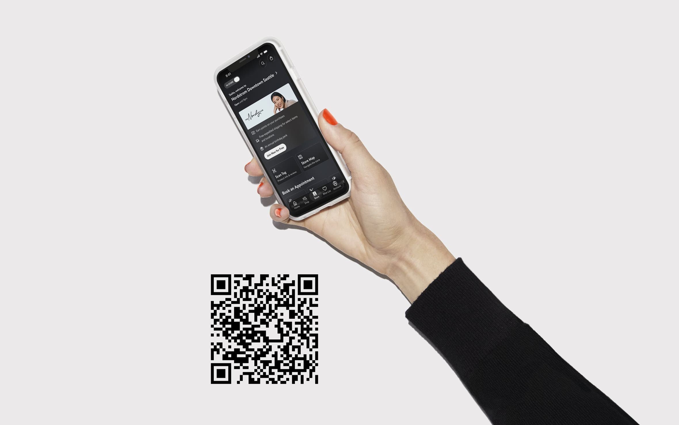 A hand holding a phone with the Nordstrom app open.