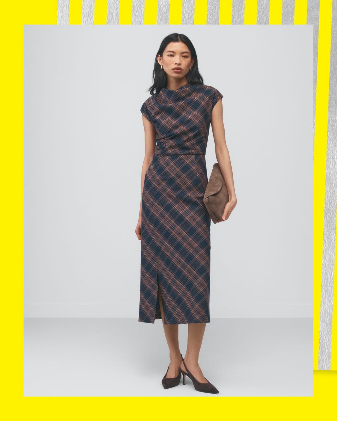 A woman in a plaid midi dress.